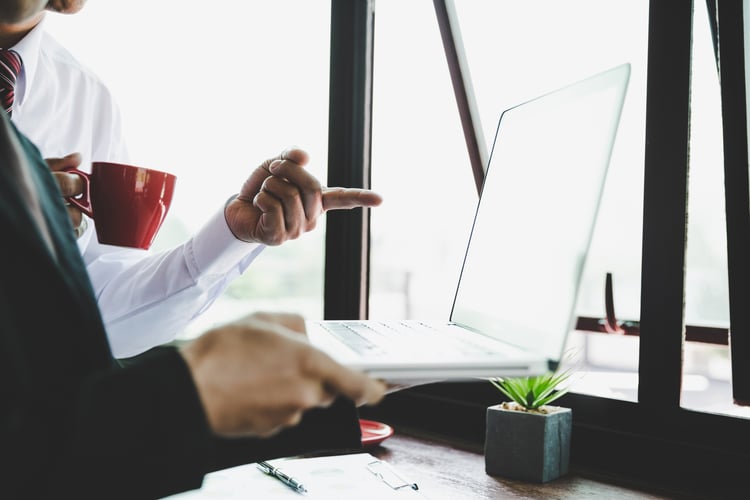 business-team-analyzing-income-charts-graphs-with-modern-laptop-computer